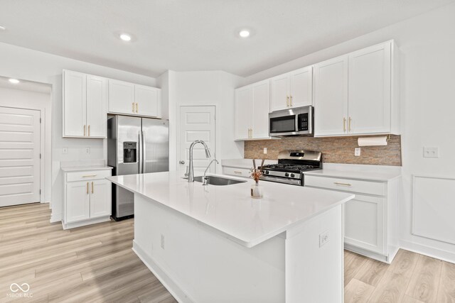7239 Governors Row, Avon, IN 46123 - kitchen with stainless steel appliances, light wood-style flooring, backsplash, white cabinetry, and recessed lighting