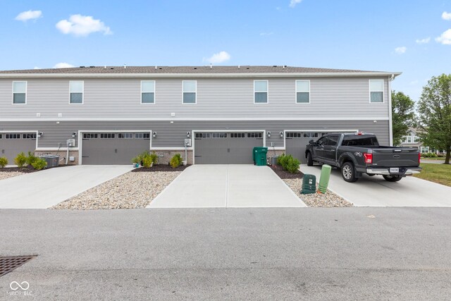 7239 Governors Row, Avon, IN 46123 - townhome / multi-family property with a garage and driveway
