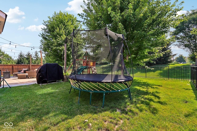 16745 Del Mar Way, Westfield, IN 46074 - fenced backyard featuring a trampoline, a playground, a patio, and an outdoor hangout area