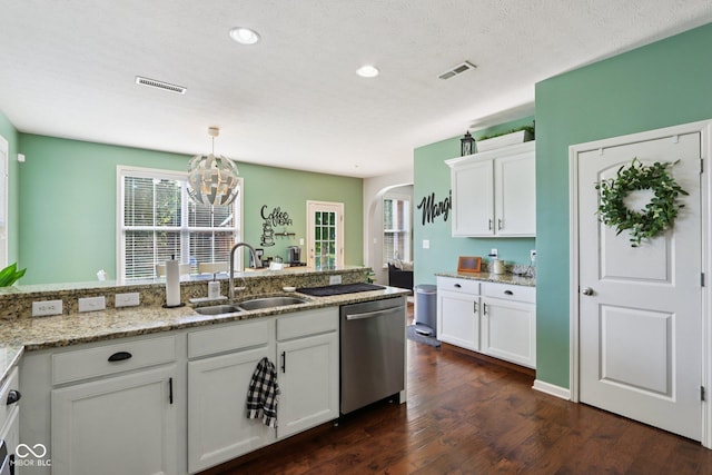 16745 Del Mar Way, Westfield, IN 46074 - kitchen featuring stainless steel dishwasher, arched walkways, dark wood-type flooring, white cabinetry, and a chandelier