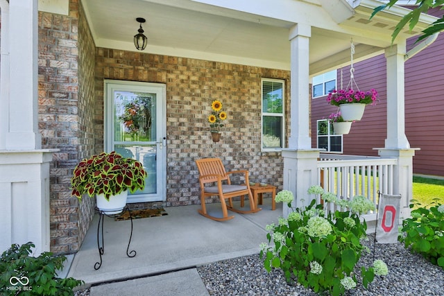 16745 Del Mar Way, Westfield, IN 46074 - property entrance featuring covered porch and brick siding