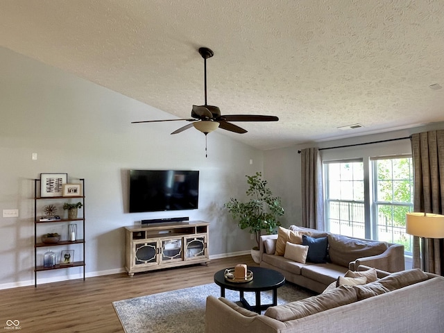 8202 Stonelick Dr, Avon, IN 46123 - living room featuring a textured ceiling, ceiling fan, wood finished floors, and vaulted ceiling