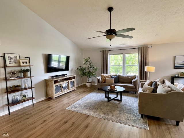 8202 Stonelick Dr, Avon, IN 46123 - living room featuring a ceiling fan, wood finished floors, a textured ceiling, and lofted ceiling