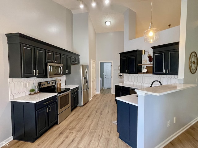 8202 Stonelick Dr, Avon, IN 46123 - kitchen with appliances with stainless steel finishes, dark cabinets, open shelves, light countertops, and tasteful backsplash