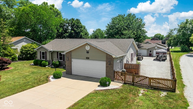 1044 Miller St, Clinton, IN 47842 - single story home featuring a garage, concrete driveway, brick siding, and a shingled roof