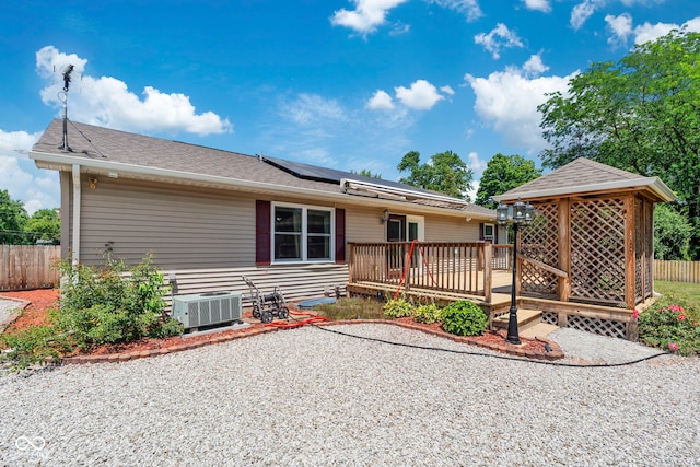 1044 Miller St, Clinton, IN 47842 - view of front of house with solar panels, a wooden deck, a gazebo, and roof with shingles