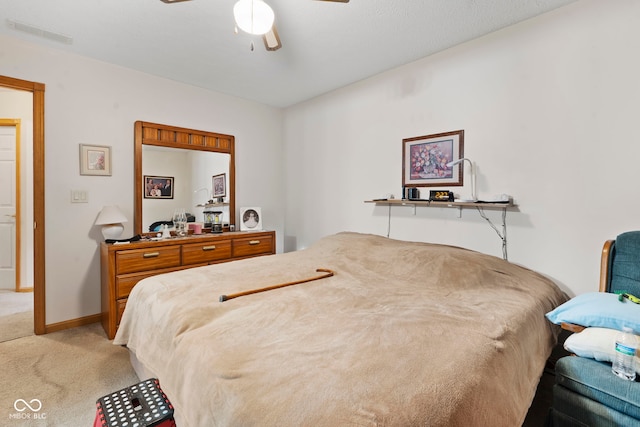 1044 Miller St, Clinton, IN 47842 - bedroom with light carpet and a ceiling fan