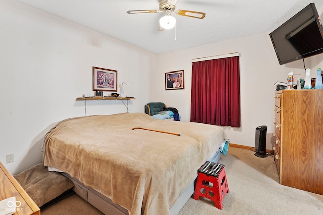 1044 Miller St, Clinton, IN 47842 - carpeted bedroom featuring baseboards and ceiling fan