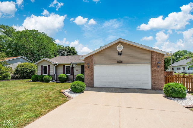 1044 Miller St, Clinton, IN 47842 - ranch-style house featuring brick siding, concrete driveway, and an attached garage