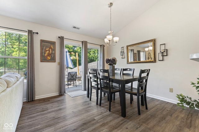 7009 Thousand Oaks Ln, Indianapolis, IN 46214 - dining area with dark wood-style floors, a chandelier, and vaulted ceiling