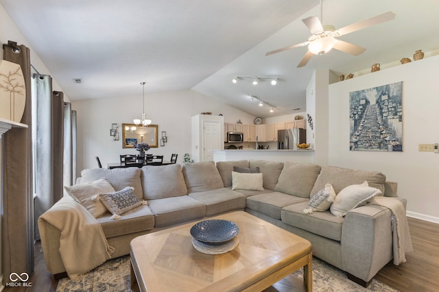7009 Thousand Oaks Ln, Indianapolis, IN 46214 - living area with vaulted ceiling, wood finished floors, a chandelier, and ceiling fan
