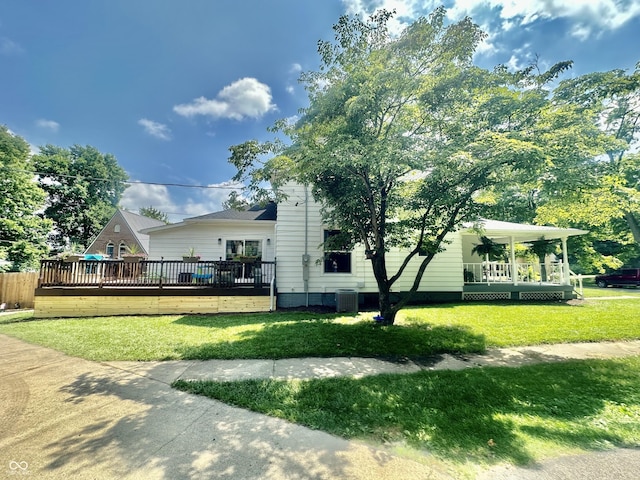 513 N Main St, Veedersburg, IN 47987 - view of side of home with a lawn and a wooden deck