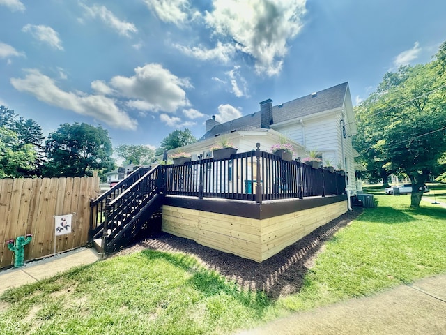 513 N Main St, Veedersburg, IN 47987 - rear view of house with a deck, a chimney, and stairway