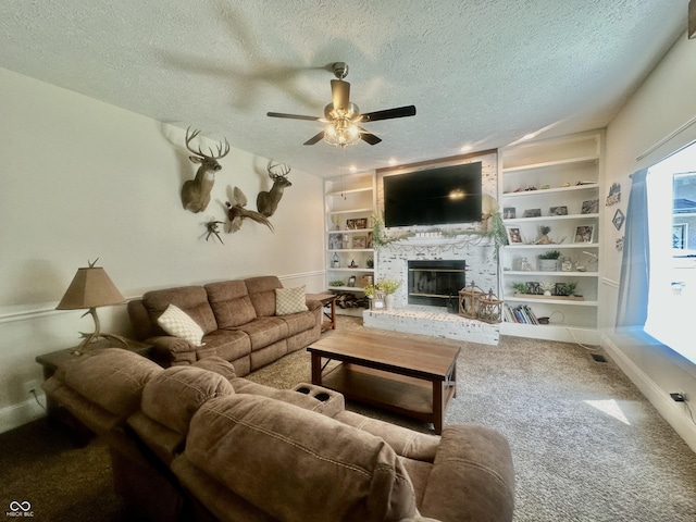 513 N Main St, Veedersburg, IN 47987 - living area featuring a textured ceiling, ceiling fan, a fireplace, built in shelves, and carpet