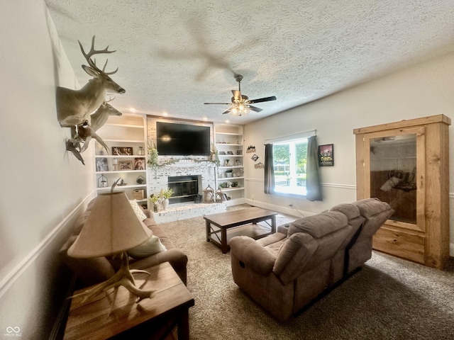 513 N Main St, Veedersburg, IN 47987 - carpeted living room featuring a textured ceiling, a ceiling fan, a brick fireplace, and built in shelves