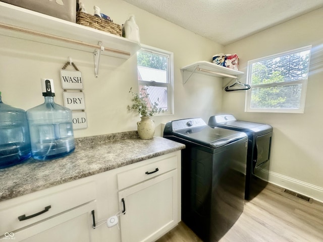 513 N Main St, Veedersburg, IN 47987 - washroom with washer and dryer, light wood-style flooring, and a textured ceiling