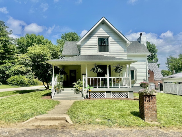 513 N Main St, Veedersburg, IN 47987 - view of front facade featuring a porch, a chimney, and roof with shingles