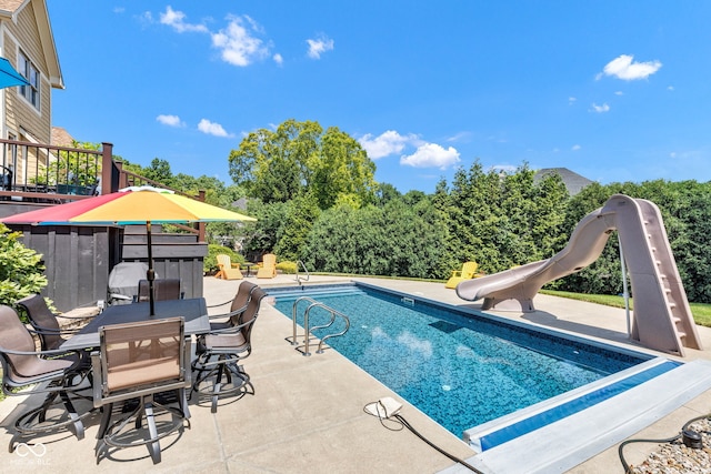 11354 Redwing Ct, Fishers, IN 46037 - swimming pool featuring a water slide, a patio area, and outdoor dining area