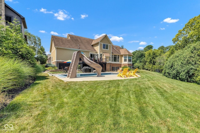 11354 Redwing Ct, Fishers, IN 46037 - rear view of house featuring an outdoor pool, a yard, and a wooden deck