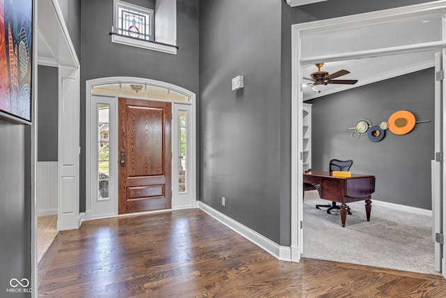 11354 Redwing Ct, Fishers, IN 46037 - entryway with a ceiling fan, wood finished floors, a towering ceiling, and crown molding