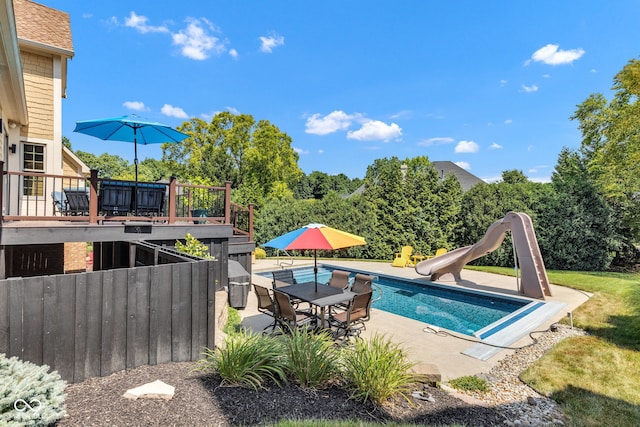 11354 Redwing Ct, Fishers, IN 46037 - view of pool with a water slide, a deck, a patio area, and outdoor dining space