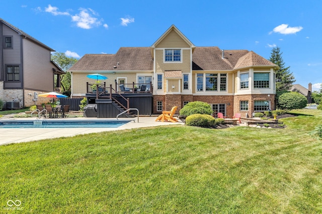 11354 Redwing Ct, Fishers, IN 46037 - rear view of house featuring stairs, a deck, a yard, an outdoor pool, and brick siding