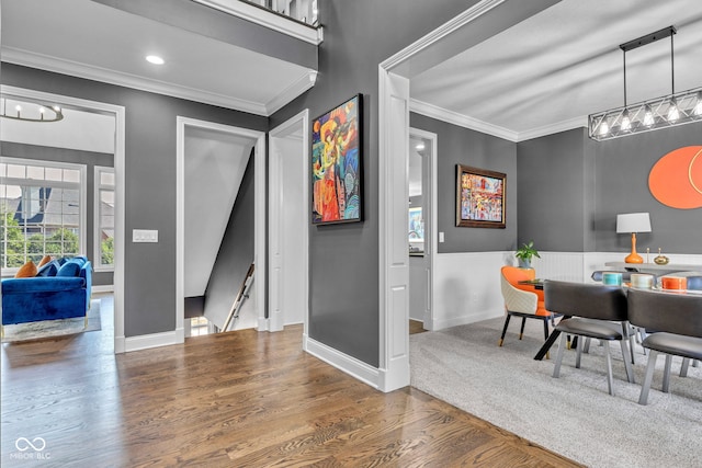 11354 Redwing Ct, Fishers, IN 46037 - dining space featuring crown molding, wood finished floors, and a chandelier