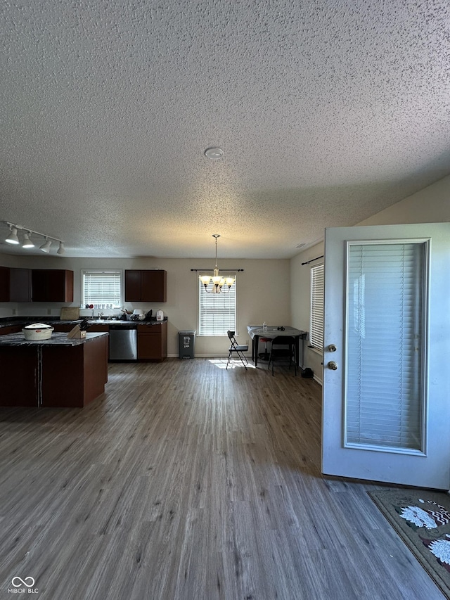 2964 Sentiment Ln, Greenwood, IN 46143 - unfurnished dining area with a chandelier, a textured ceiling, and dark wood-style floors
