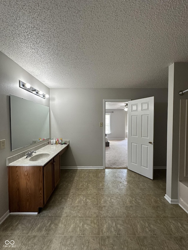 2964 Sentiment Ln, Greenwood, IN 46143 - full bathroom with a textured ceiling, vanity, ceiling fan, tile patterned flooring, and a shower