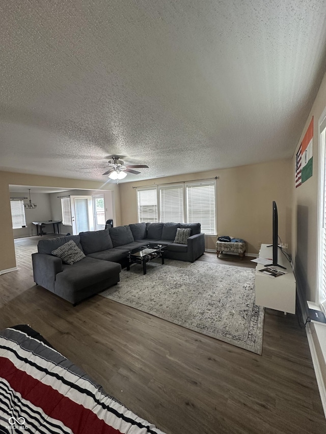 2964 Sentiment Ln, Greenwood, IN 46143 - living area featuring wood finished floors, a textured ceiling, and ceiling fan