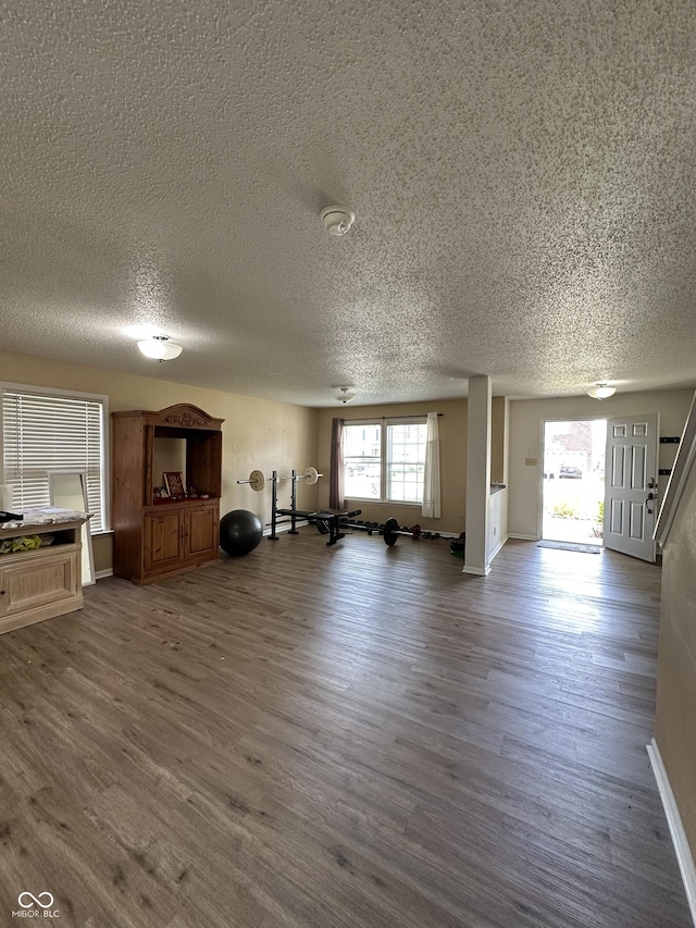 2964 Sentiment Ln, Greenwood, IN 46143 - workout area featuring a textured ceiling and dark wood finished floors