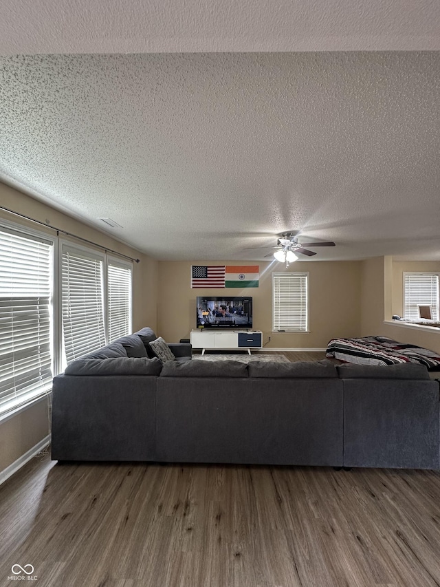 2964 Sentiment Ln, Greenwood, IN 46143 - living area featuring a textured ceiling, wood finished floors, and a ceiling fan