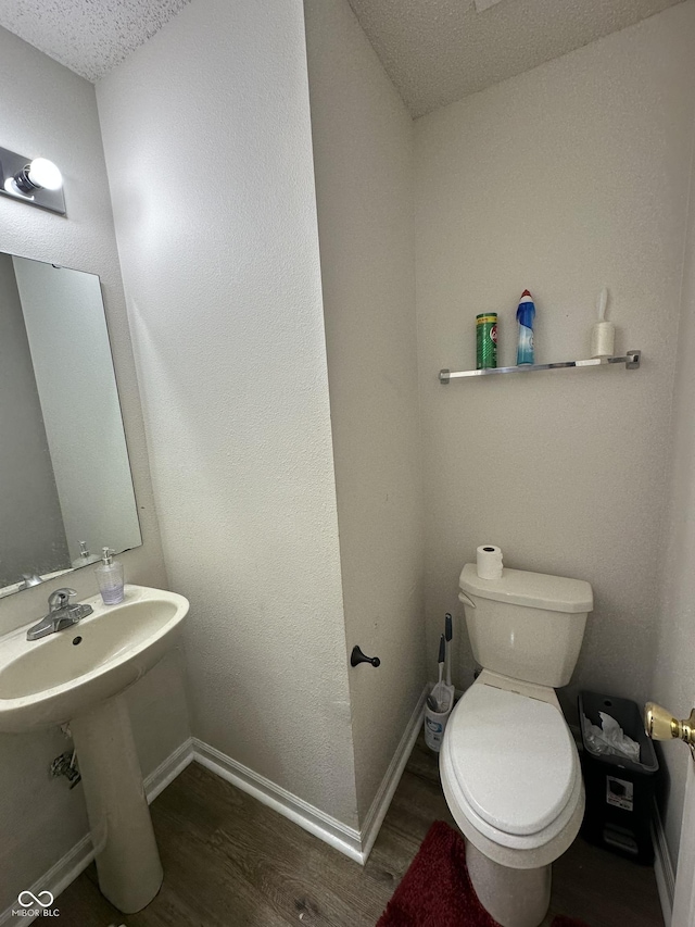 2964 Sentiment Ln, Greenwood, IN 46143 - half bath with wood finished floors and a textured ceiling