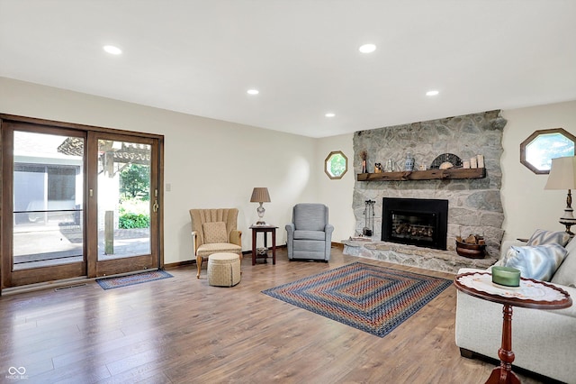 3280 E 300 S, Greenfield, IN 46140 - living area featuring wood finished floors, a stone fireplace, and recessed lighting