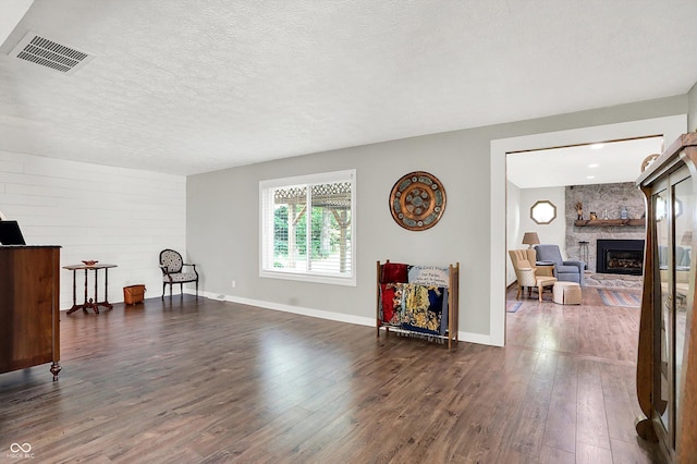 3280 E 300 S, Greenfield, IN 46140 - sitting room with a large fireplace, dark wood finished floors, and a textured ceiling