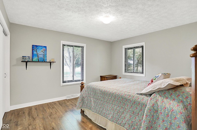 3280 E 300 S, Greenfield, IN 46140 - bedroom featuring wood finished floors and a textured ceiling