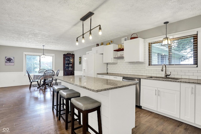 3280 E 300 S, Greenfield, IN 46140 - kitchen featuring white refrigerator with ice dispenser, a textured ceiling, stainless steel dishwasher, tasteful backsplash, and dark wood-style flooring