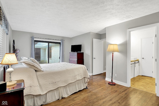 3280 E 300 S, Greenfield, IN 46140 - bedroom with wood finished floors and a textured ceiling