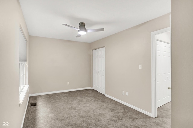 3084 Armory Dr, Indianapolis, IN 46208 - unfurnished bedroom with carpet flooring, a closet, and a ceiling fan