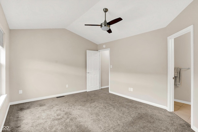 3084 Armory Dr, Indianapolis, IN 46208 - unfurnished bedroom featuring carpet, lofted ceiling, and ceiling fan