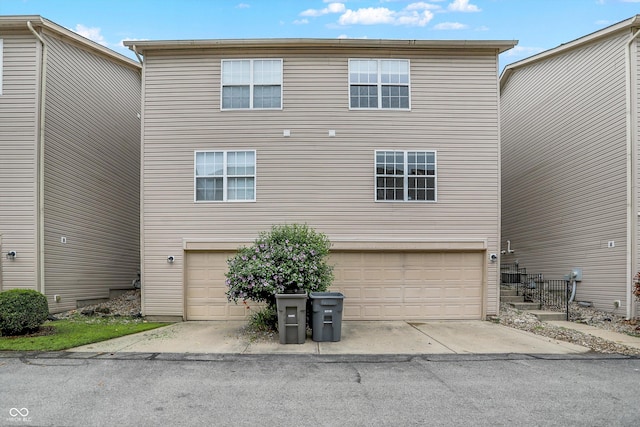 3084 Armory Dr, Indianapolis, IN 46208 - back of house featuring an attached garage