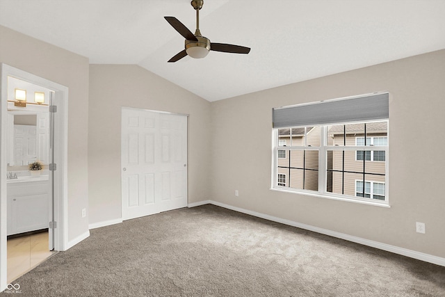 3084 Armory Dr, Indianapolis, IN 46208 - unfurnished bedroom featuring carpet flooring, lofted ceiling, a ceiling fan, and ensuite bathroom