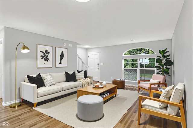 3084 Armory Dr, Indianapolis, IN 46208 - living room featuring stairway and light wood-style flooring