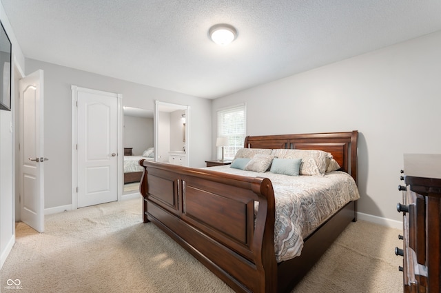 7045 W 100 N, Greenfield, IN 46140 - bedroom featuring light colored carpet and connected bathroom