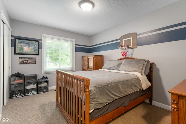 7045 W 100 N, Greenfield, IN 46140 - bedroom featuring carpet, a closet, and a textured ceiling