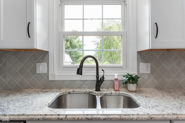 7045 W 100 N, Greenfield, IN 46140 - kitchen featuring white cabinets, tasteful backsplash, and plenty of natural light