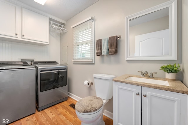 7045 W 100 N, Greenfield, IN 46140 - laundry room with separate washer and dryer and light wood-style floors