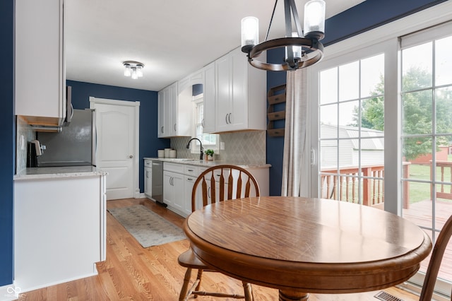 7045 W 100 N, Greenfield, IN 46140 - dining room featuring a chandelier and light wood finished floors