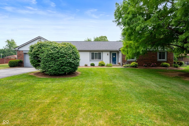 7045 W 100 N, Greenfield, IN 46140 - ranch-style house featuring a front lawn, brick siding, driveway, and a garage