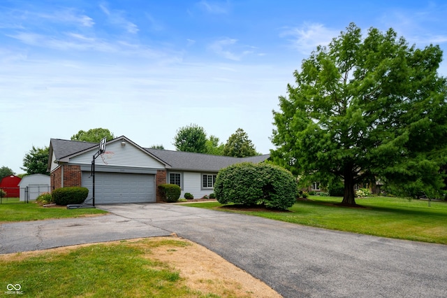 7045 W 100 N, Greenfield, IN 46140 - ranch-style house with asphalt driveway, an attached garage, and brick siding
